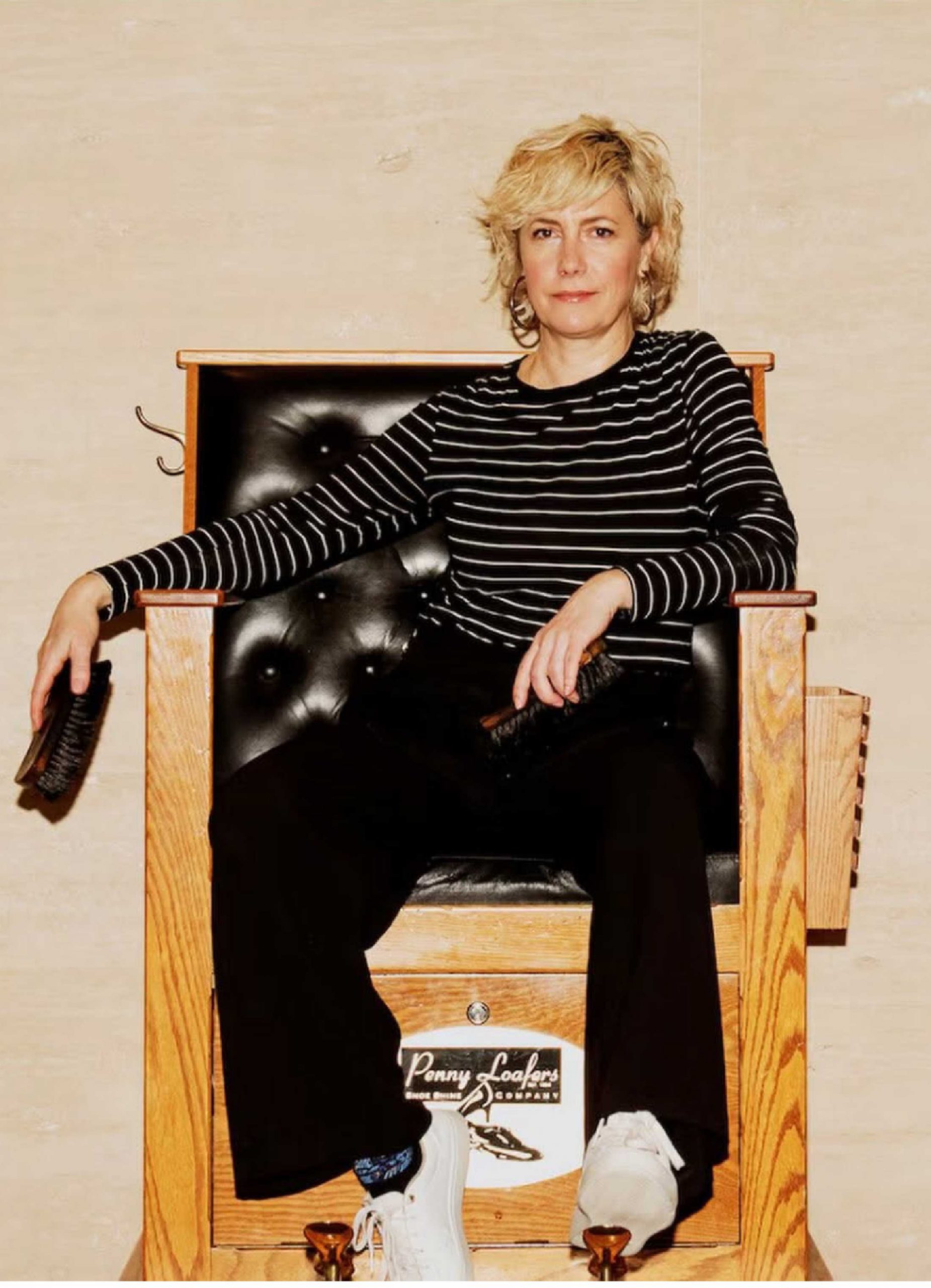 Jenny Young Jenny Young, owner of Penny Loafers Shoe Shine, seated in her shoe-shining chair at the professional shoe shine shop. Pictured in the Globe and Mail